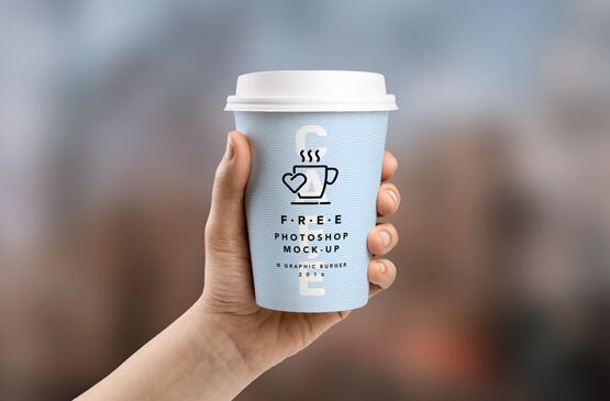 Coffee Cup In Hand MockUp