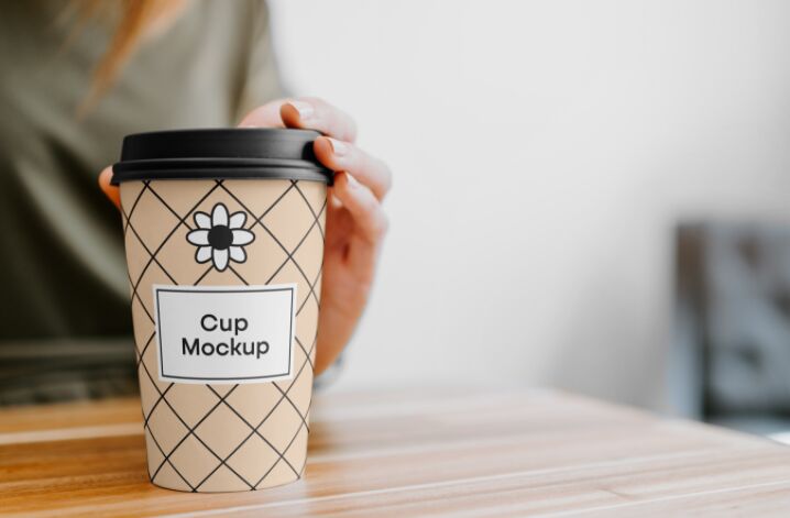 Coffee Cup with Hand Mockup