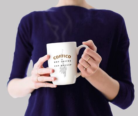 Woman Holding A Coffee Mug Mockup PSD